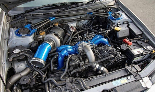 Turbocharger Upgrade NZ with a performance turbo beside a car engine